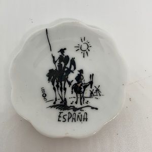 Don Quixote?  Pancho?  I don’t know but I see some windmills on this tiny plate